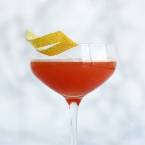 clear cocktail glass with beverage